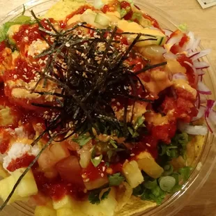 Large brown rice and tortilla chip based poki bowl with all the spicy options (volcano 3!)