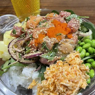 a bowl of food with rice and vegetables