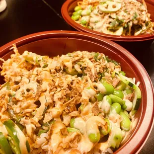 two bowls of food on a table