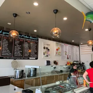 On the left is the Poki menu and on the right ( the white board ) is the drink menu.