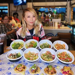 a woman holding a plate of food