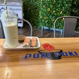 Avocado Lust smoothie with an order of shrimp spring rolls (4). I ate two already!