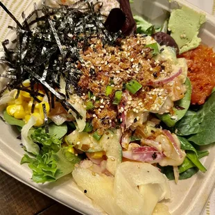 a salad in a styrofoam container