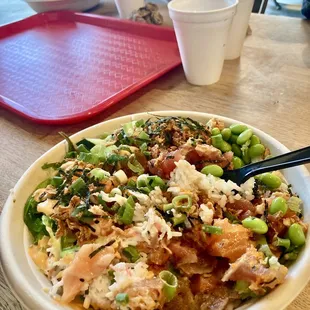 a bowl of asian food on a table