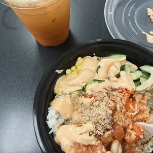 Bowl: shrimp, salmon, spicy crab, (teriyaki sauce), corn, cucumbers, masago, fried onions, another crunch topping (?), spicy mayo.