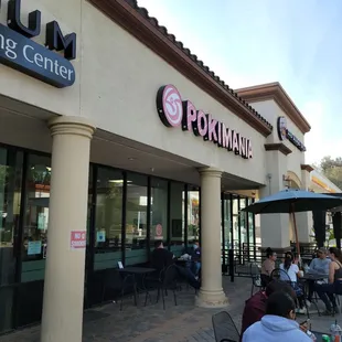 people sitting outside a restaurant