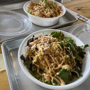 two bowls of food on a tray