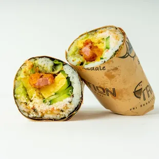 two pieces of sushi wrapped in brown paper