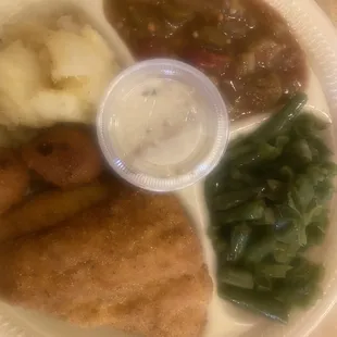 Fried fish, green beans, potatoes and okra.