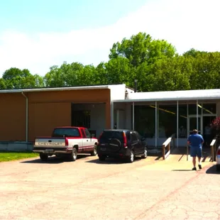 two people walking out of the building