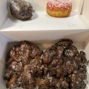 Blueberry cake, peach/apple fritter and a cherry coconut donut.