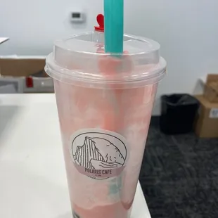 An almost finished white grape, oolong tea with strawberry cream with boba, no ice.  Grape not overpowering.  Bobas on more soft chewy side