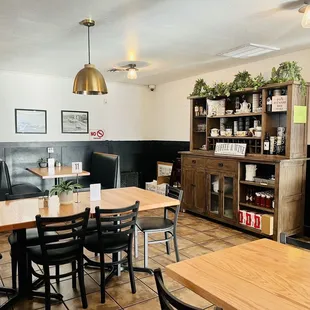 a dining area with tables and chairs