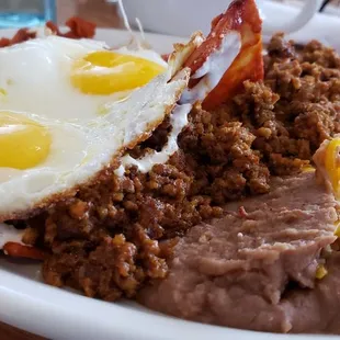 Red Sauce Chilaquiles with Chorizo ($3 xtra). Refined experience.