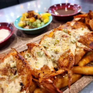 Diablitos jumbo shrimp fries guach and chips with the mango cucumber salada