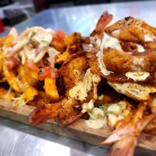 cheese fries with pico de gallo chicken strips and 4 diablito shrimp with house sauce
