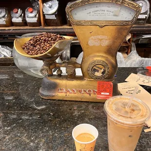 a coffee grinder and a cup of coffee