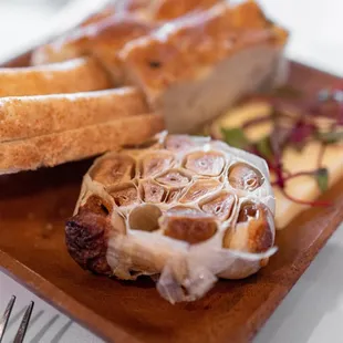 Complimentary Gluten-free bread, roasted garlic and butter ($0)