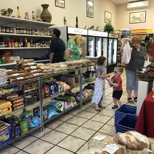 a woman and a child in a grocery store
