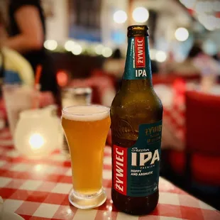 a beer and a glass on a table