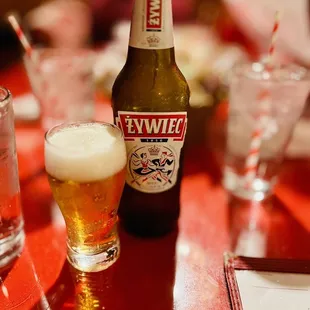 a glass of beer and a bottle