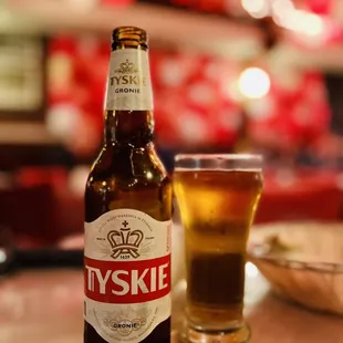 a bottle and a glass of beer