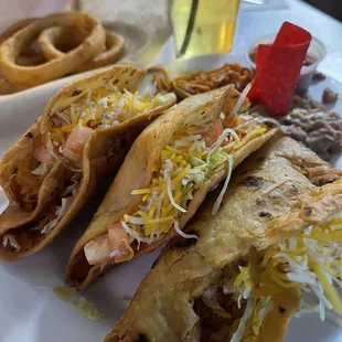 white chicken tacos, fideo, beans, onion rings, schooner