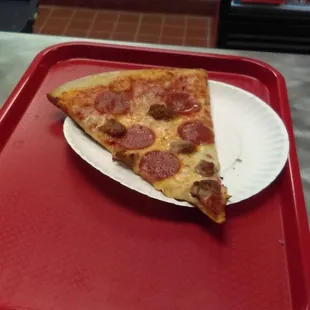 A slice of New York-style pepperoni and sausage.