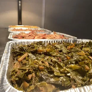 two trays of cooked greens