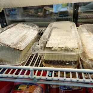 a variety of desserts in plastic containers