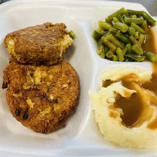Salmon croquettes, mashed potatoes and green beans.