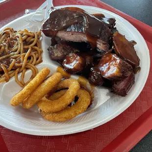 Old, cold rib tips and ribs along with cold bbq spaghetti.   Onion rings are crap quality but I still like them.