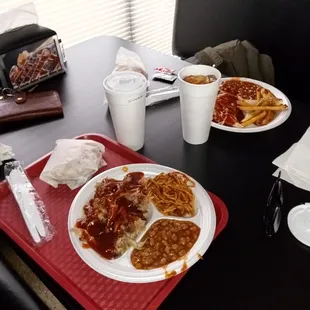 two plates of spaghetti and beans