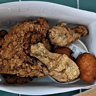 This is the fried chicken with 2 breasts, 2 legs, puffs, mashed potatoes, and macaroni and cheese.  Photo taken December 31, 2021.