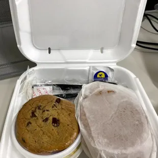 Fried chicken sandwich, country potato salad, fresh fruit, chocolate chip cookie