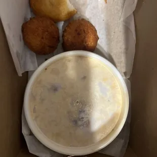 a bowl of soup and some fried bread