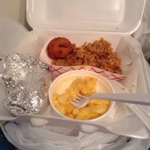 Pulled chicken w/ mac &amp; cheese, hush puppies, &amp; a baked sweet potato. Chicken had okay flavor, but would've been less dry w/ more dark meat.