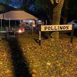 a sign in the middle of a park