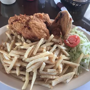 a plate of fried chicken and french fries