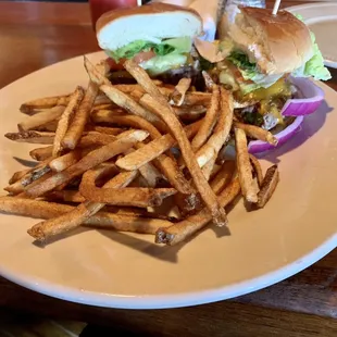a plate of french fries and a burger