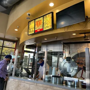 a man standing in front of a counter