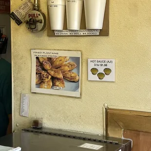 Plantains advertised on a filthy wall.