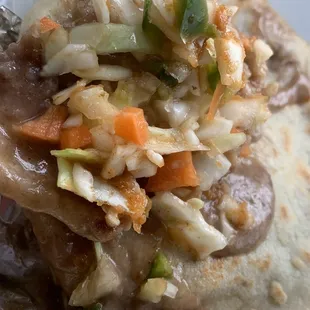 a close up of a burrito