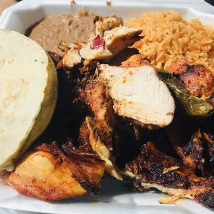 Half chicken comes piping hot with rice beans &amp; tortillas. Ask for the HOT sauce on the side OMG! Bueno Bueno! Get it! :)..