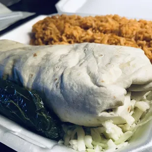 Enormous Chicken burrito comes with salad, jalapeño &amp; rice &amp; beans we got double rice bc they were out of beans