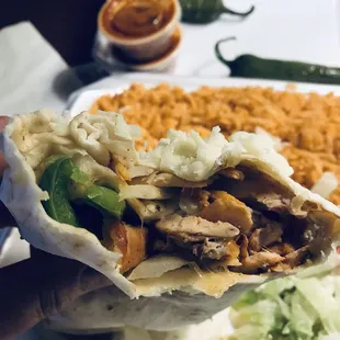 Filled with tender juicy grilled Fajita chicken, Oaxaca cheese, bell peppers HOLY BURRITO !!! Best one I have EVER HAD!!! Get it :)...