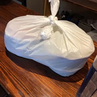 a bag of toilet paper on a counter