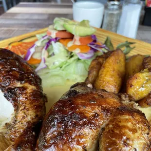 Roasted (1/2) chicken w/ avocado salad and fried plantains.