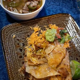 Beans, rice, guacamole, and half a burrito pastor
