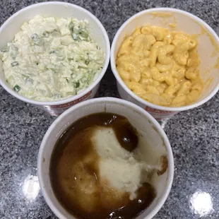 Mac and cheese, cole slaw, mashed potato and gravy.
